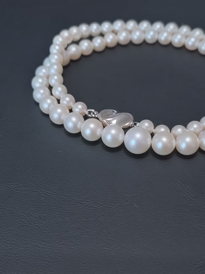 Akoya genuine pearl necklace with white pearls and silver clasp single strand design