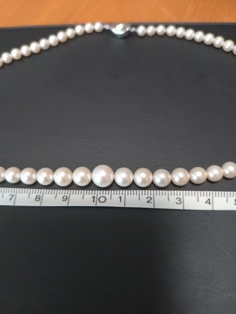 Akoya genuine pearl necklace with white pearls and silver clasp single strand design