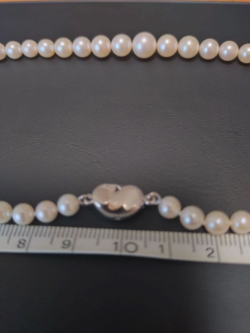 Akoya genuine pearl necklace with white pearls and silver clasp single strand design