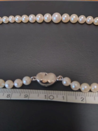 Akoya genuine pearl necklace with white pearls and silver clasp single strand design