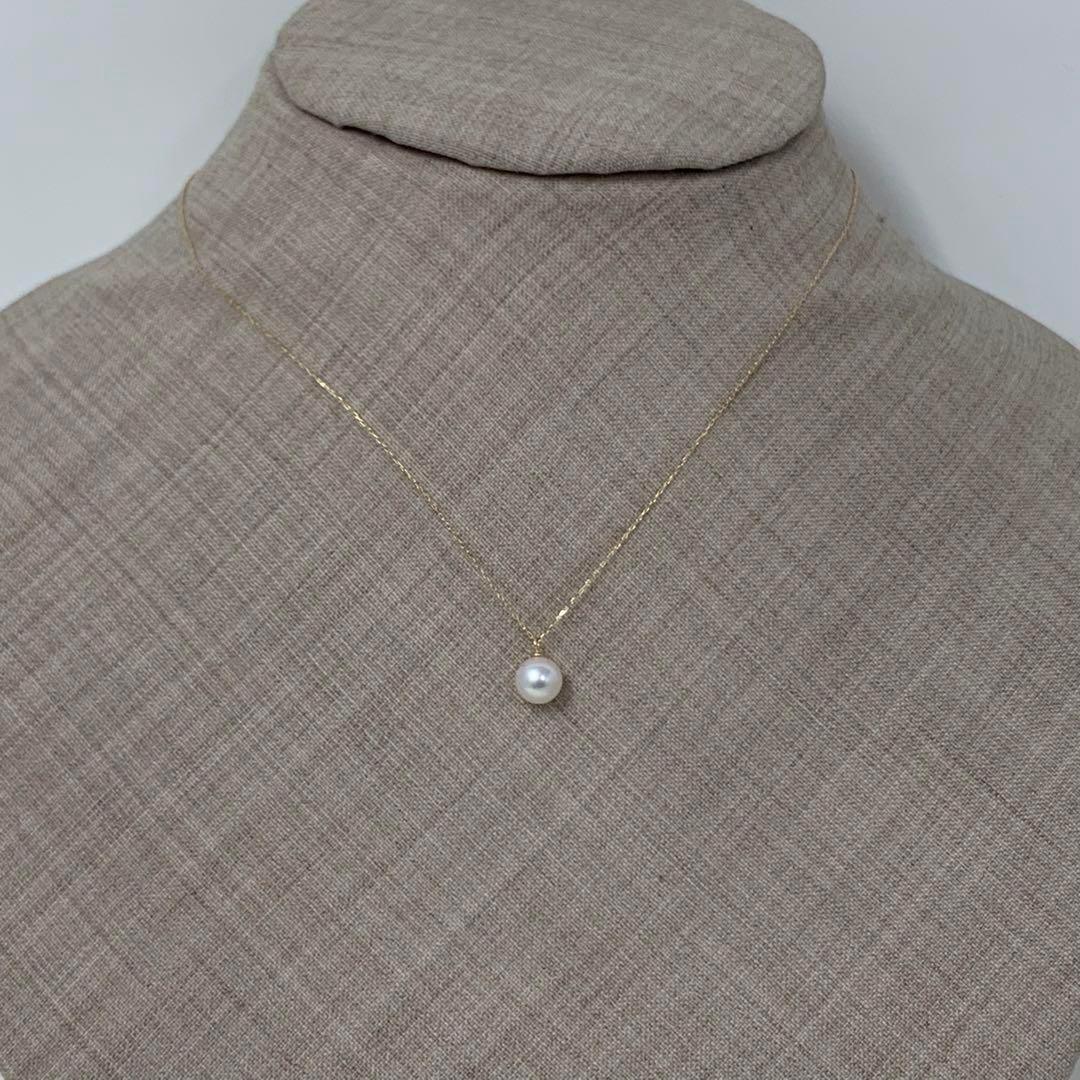 K18 Akoya pearl necklace with 6mm pearls and 40cm gold chain on white background