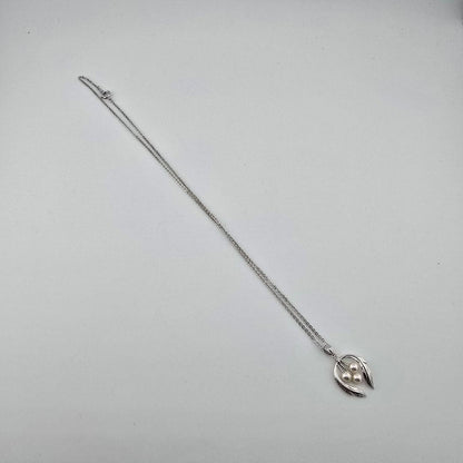 Vintage MIKIMOTO silver necklace with three 4mm pearls on a 23cm chain with engraved clasp