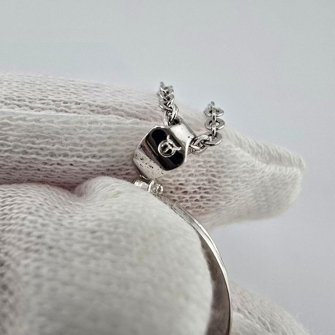 Vintage MIKIMOTO silver necklace with three 4mm pearls on a 23cm chain with engraved clasp