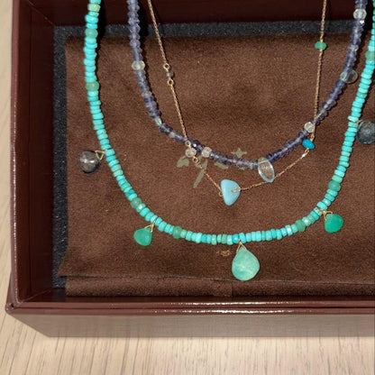 Agete 3-row necklace with turquoise, larimar, blue topaz, tanzanite, and quartz stones in blue tones on K10 gold