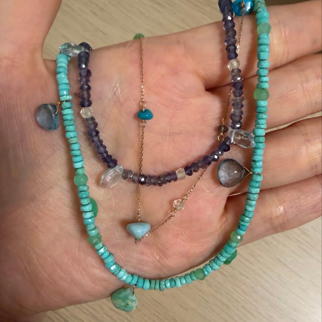 Agete 3-row necklace with turquoise, larimar, blue topaz, tanzanite, and quartz stones in blue tones on K10 gold