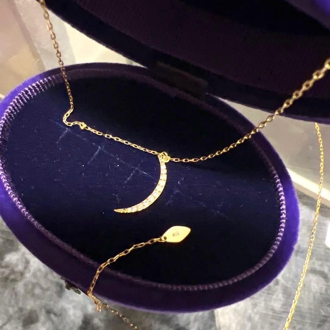 Agete K18 diamond crescent moon necklace with 48cm length displayed on a white background