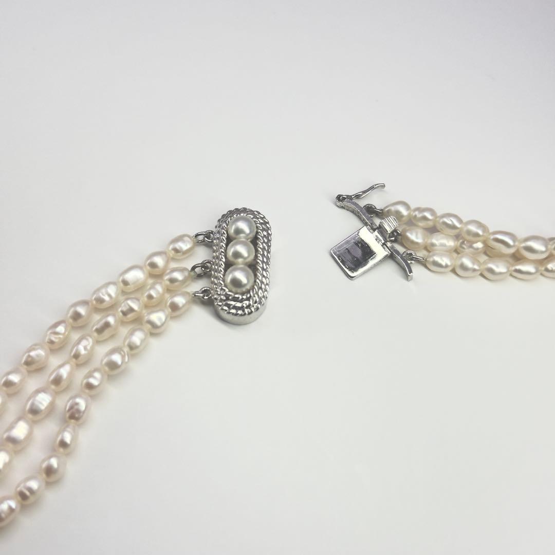 Tasaki SV Baroque Pearl triple strand necklace approximately 55cm long displayed on white background