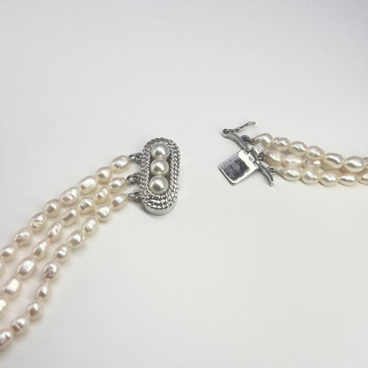 Tasaki SV Baroque Pearl triple strand necklace approximately 55cm long displayed on white background