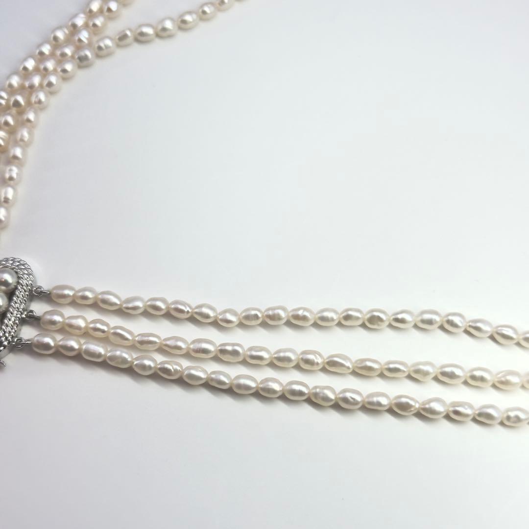 Tasaki SV Baroque Pearl triple strand necklace approximately 55cm long displayed on white background