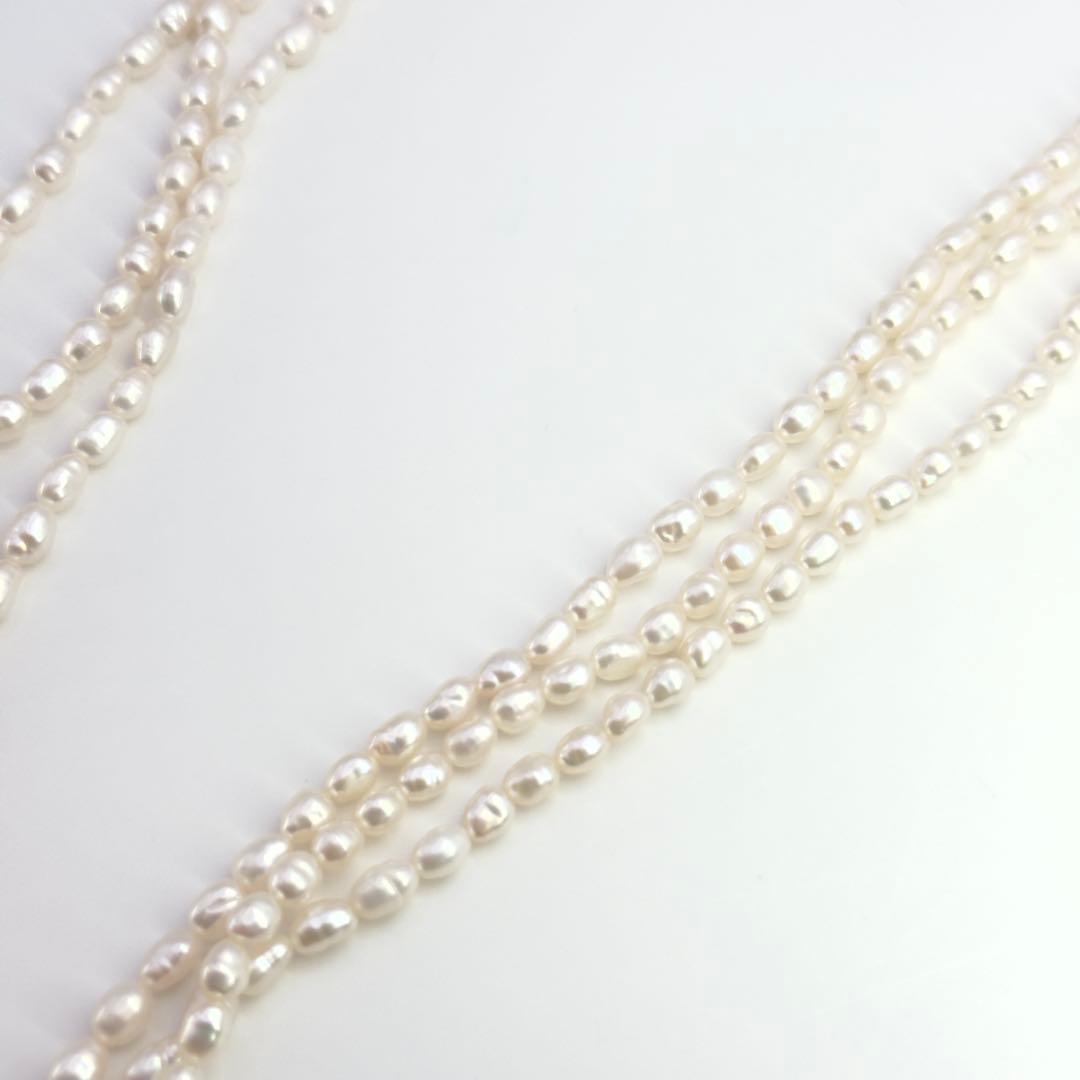 Tasaki SV Baroque Pearl triple strand necklace approximately 55cm long displayed on white background