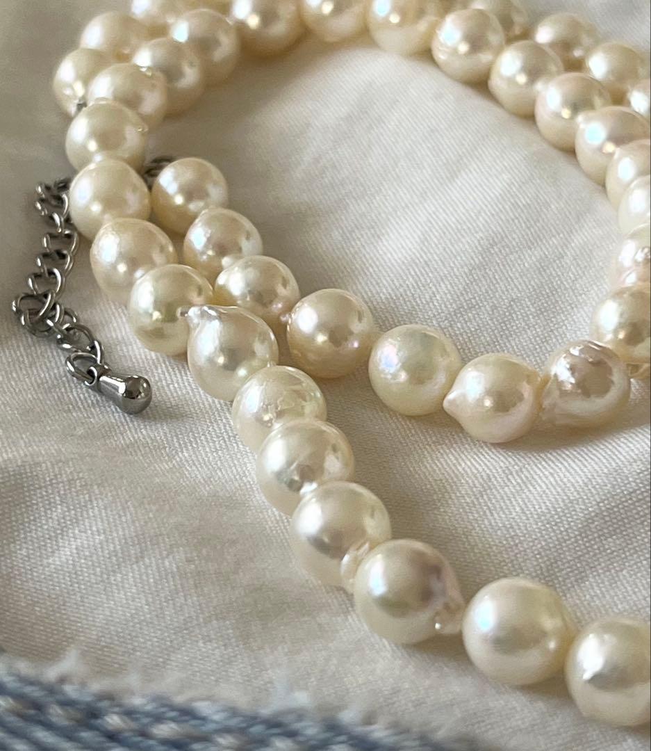 Akoya pearl necklace and earring set with 6.5 to 7 mm pearls, stainless steel clasp, and rhodium plated screw-back earrings