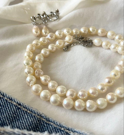 Akoya pearl necklace and earring set with 6.5 to 7 mm pearls, stainless steel clasp, and rhodium plated screw-back earrings