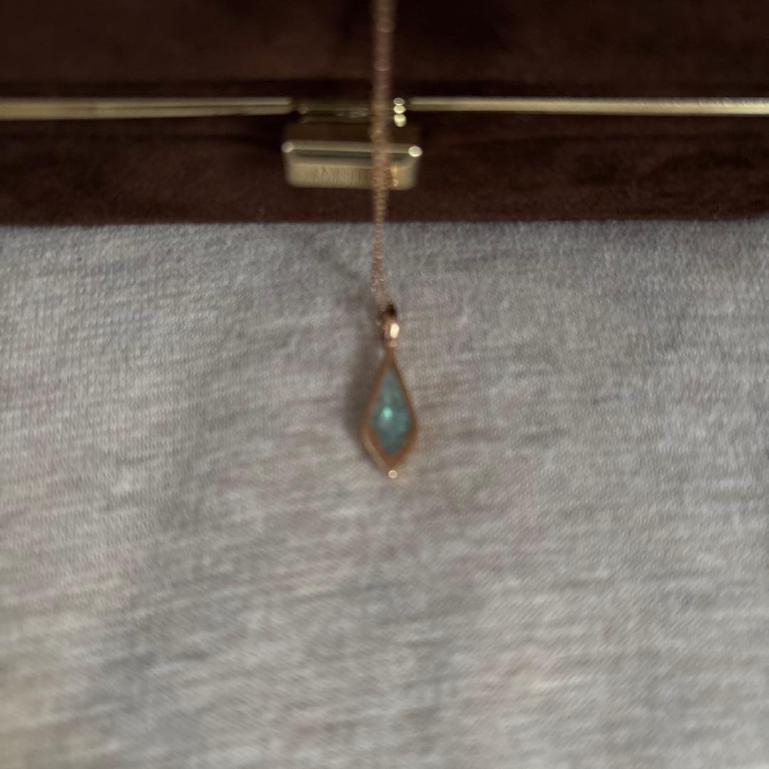 Agate K10 necklace charm with Amber, Turquoise, Larimar stones and shell detail on a silver chain