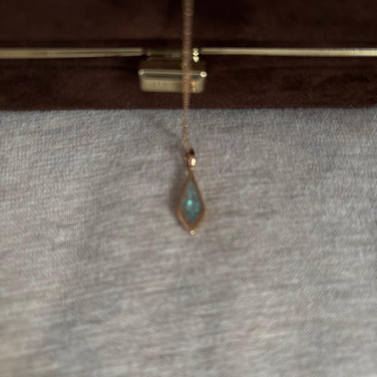 Agate K10 necklace charm with Amber, Turquoise, Larimar stones and shell detail on a silver chain