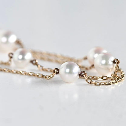 Kuro Pearl Station Necklace featuring nine round pearls with K18 clasp on a 37.5 cm chain