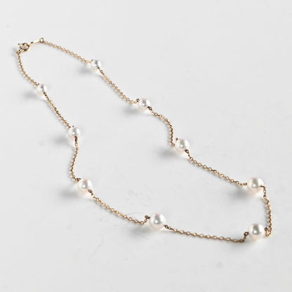 Kuro Pearl Station Necklace featuring nine round pearls with K18 clasp on a 37.5 cm chain