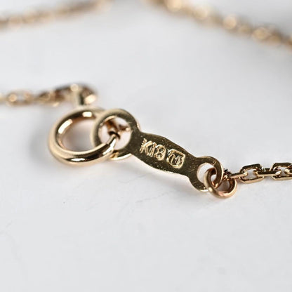 Kuro Pearl Station Necklace featuring nine round pearls with K18 clasp on a 37.5 cm chain
