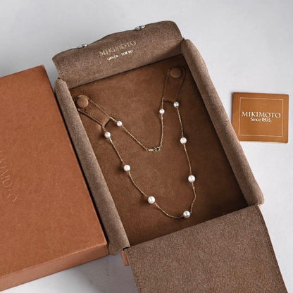 Kuro Pearl Station Necklace featuring nine round pearls with K18 clasp on a 37.5 cm chain