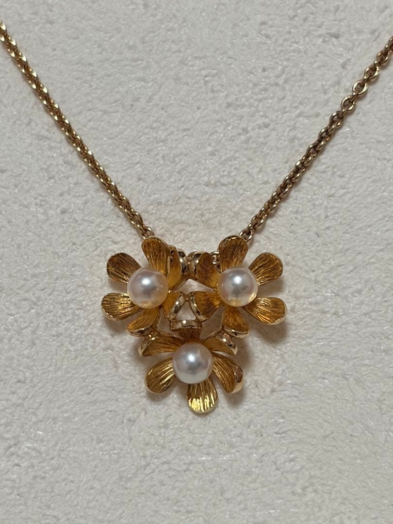 Mikimoto K18 gold baby pearl necklace with 3-row flower motif design weighing 4.5 grams