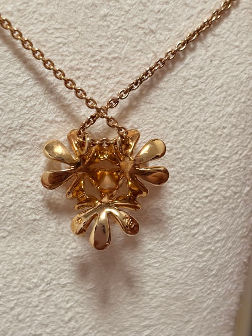 Mikimoto K18 gold baby pearl necklace with 3-row flower motif design weighing 4.5 grams