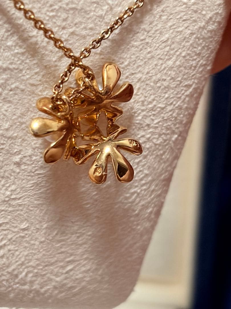 Mikimoto K18 gold baby pearl necklace with 3-row flower motif design weighing 4.5 grams