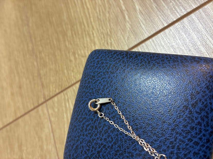Close-up of Mikimoto elegant pearl necklace with 7-8mm white pearls strung on a delicate chain