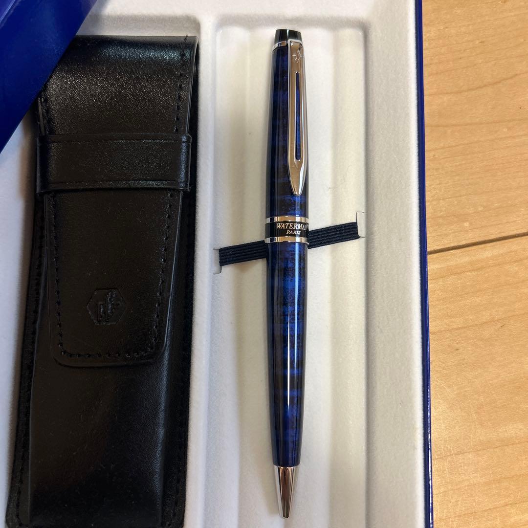 WATERMAN ballpoint pen with blue ink alongside its protective case on a white background