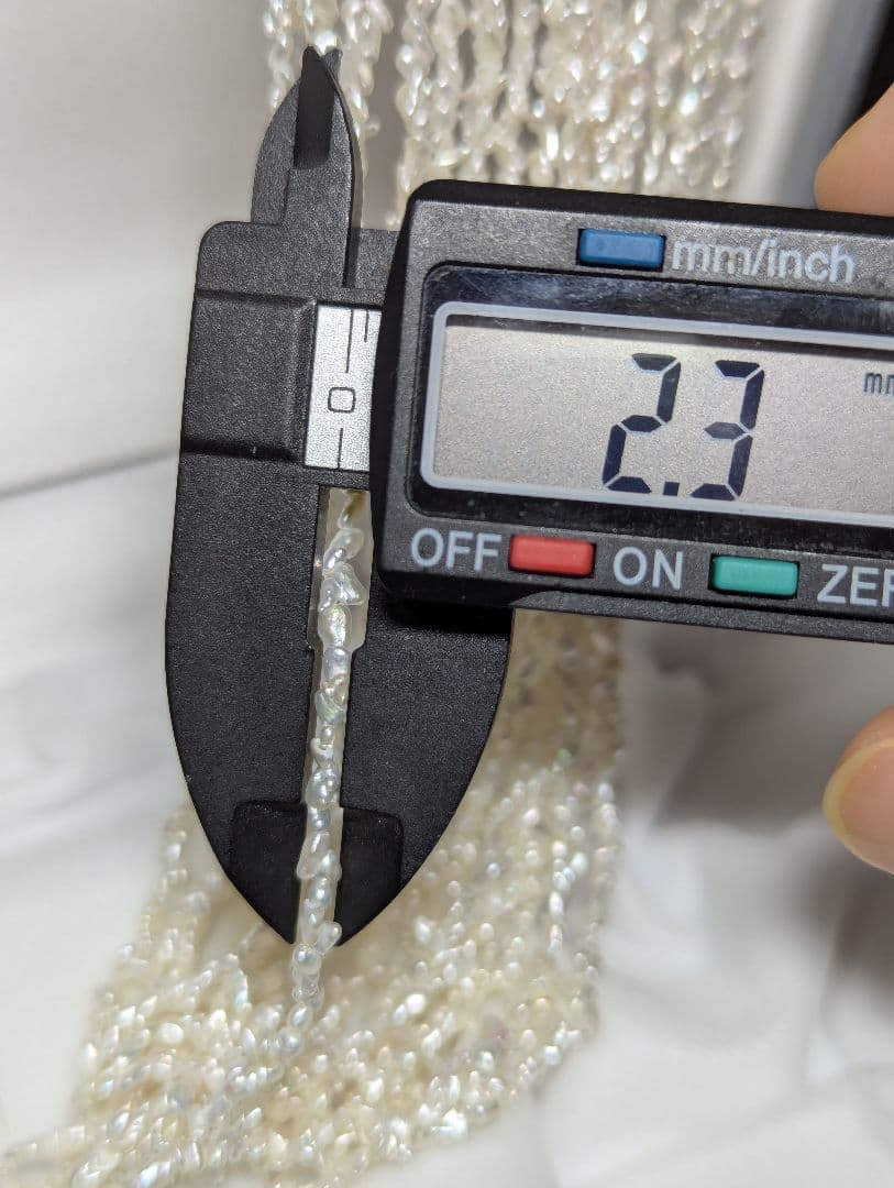N97 Sorting Akoya pearls 10-string Kesshi necklace with 2-4 mm pearls, 48.5 cm length, displayed on white background