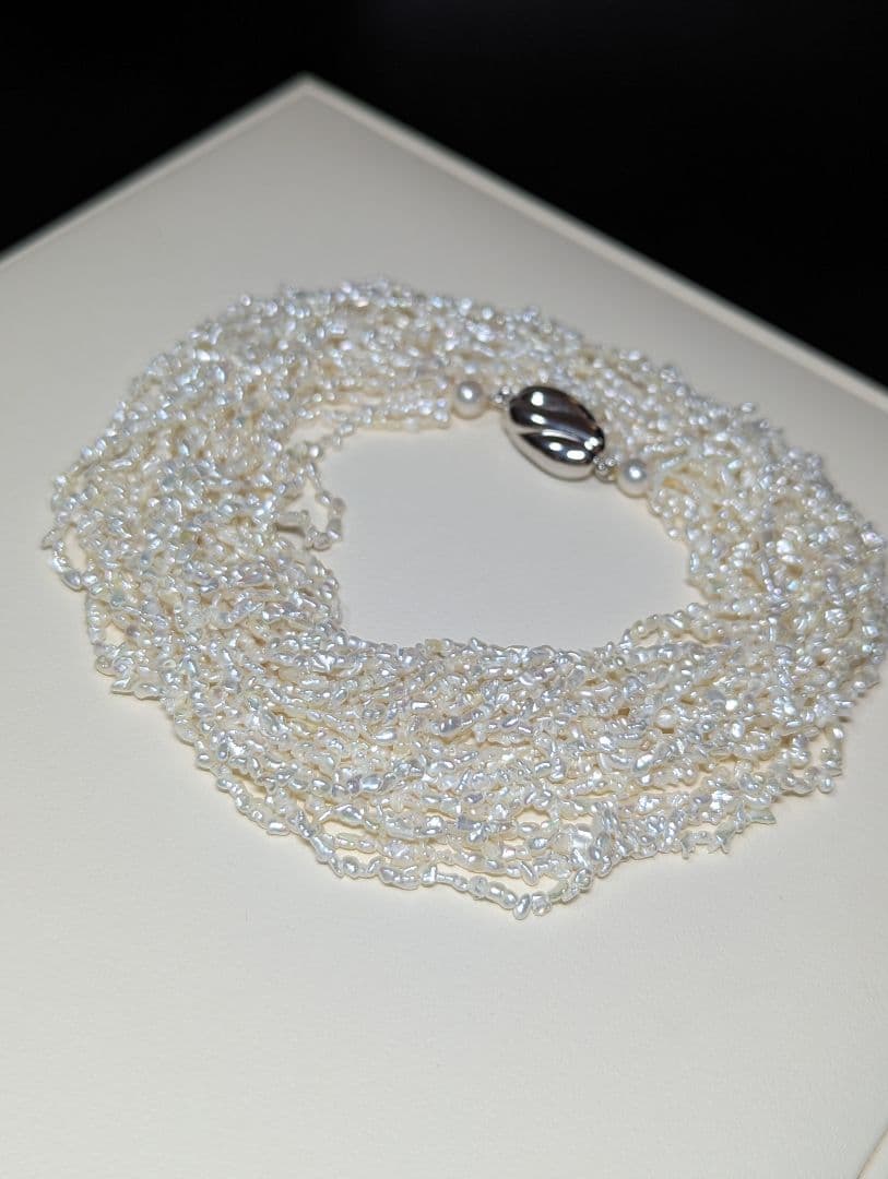 N97 Sorting Akoya pearls 10-string Kesshi necklace with 2-4 mm pearls, 48.5 cm length, displayed on white background