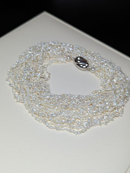 N97 Sorting Akoya pearls 10-string Kesshi necklace with 2-4 mm pearls, 48.5 cm length, displayed on white background