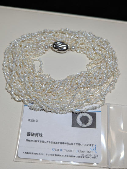 N97 Sorting Akoya pearls 10-string Kesshi necklace with 2-4 mm pearls, 48.5 cm length, displayed on white background