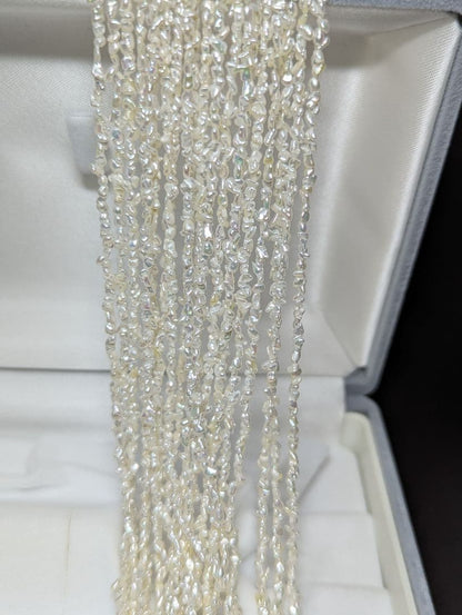 N97 Sorting Akoya pearls 10-string Kesshi necklace with 2-4 mm pearls, 48.5 cm length, displayed on white background