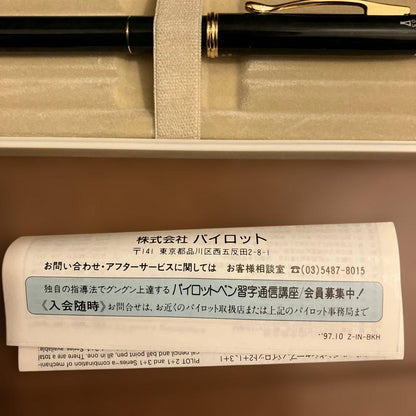 Pilot ballpoint pen and mechanical pencil set with instruction manual on a white background