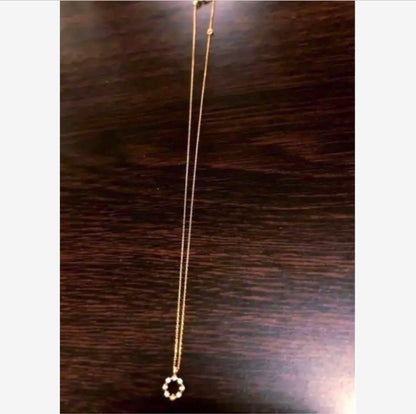 Agate necklace featuring K18 18 karat gold with diamond decorations on a clean white background
