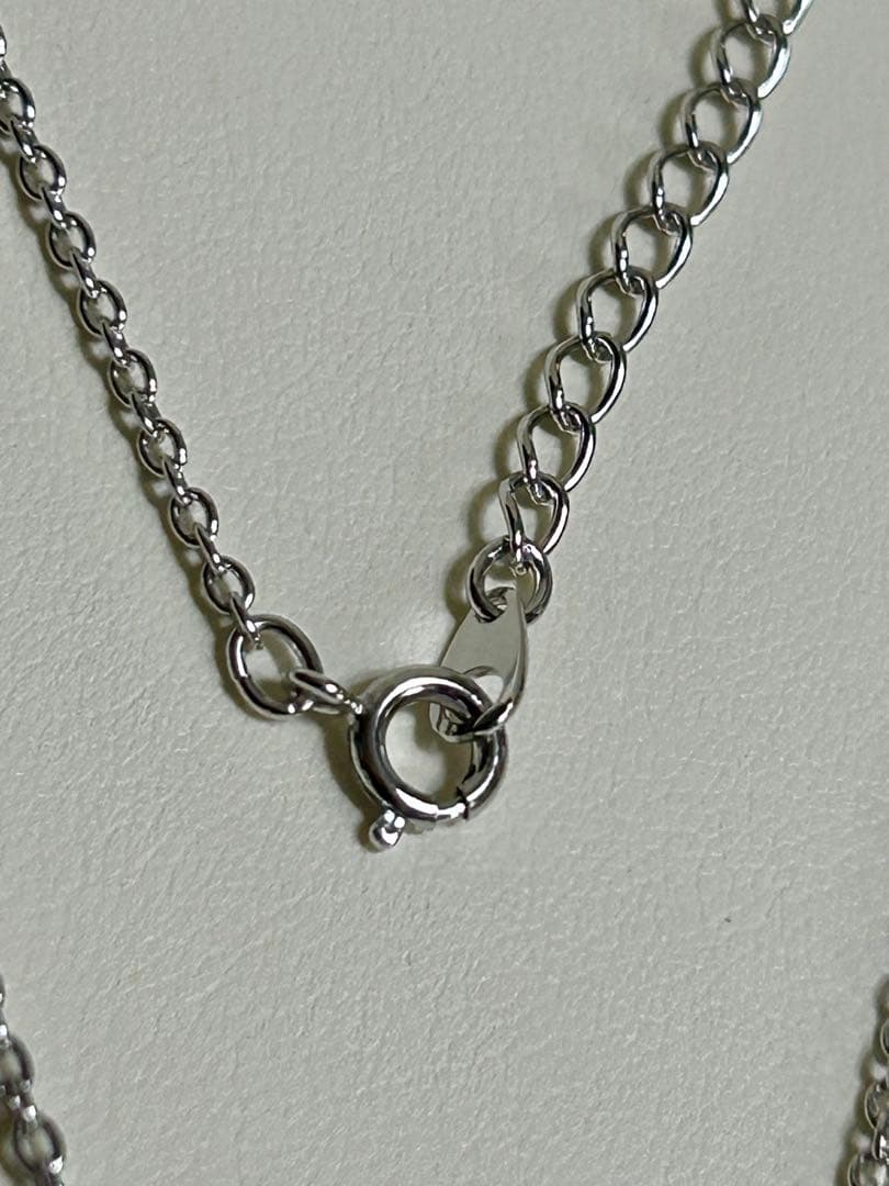 Tasaki pearl necklace with a 12mm Mabe pearl pendant on a silver chain showing Tasaki silver stamp