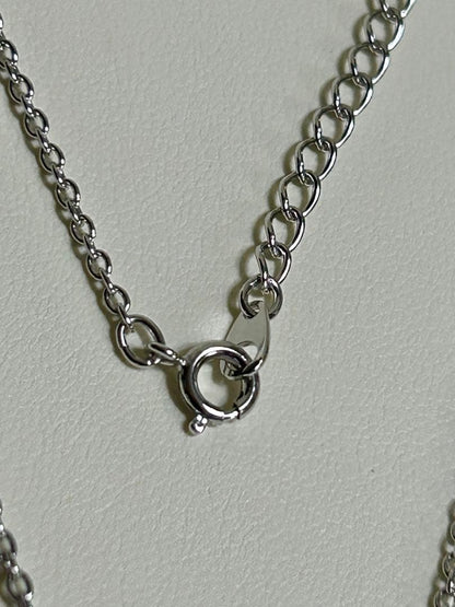 Tasaki pearl necklace with a 12mm Mabe pearl pendant on a silver chain showing Tasaki silver stamp