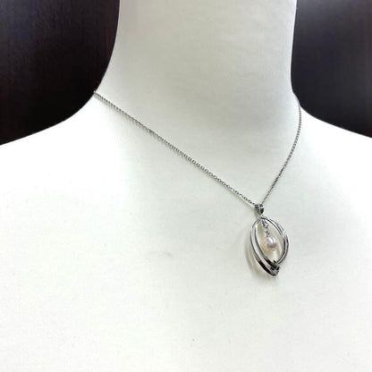 Mikimoto pearl necklace in silver with detailed clasp and round pearls displayed