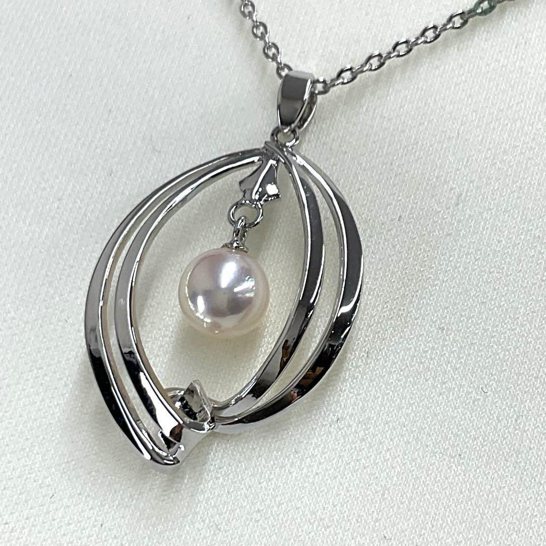 Mikimoto pearl necklace in silver with detailed clasp and round pearls displayed