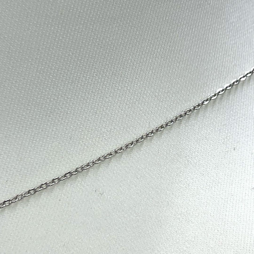 Mikimoto pearl necklace in silver with detailed clasp and round pearls displayed