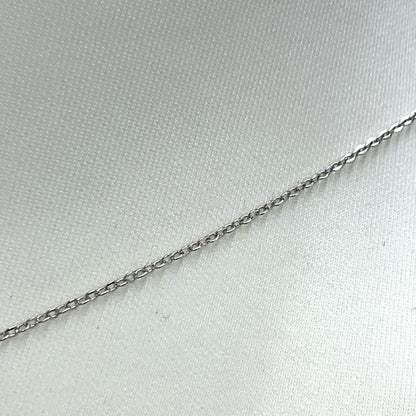 Mikimoto pearl necklace in silver with detailed clasp and round pearls displayed