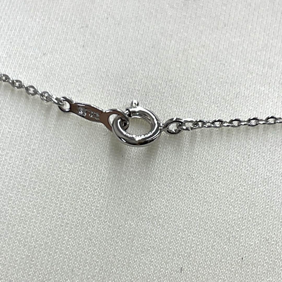 Mikimoto pearl necklace in silver with detailed clasp and round pearls displayed