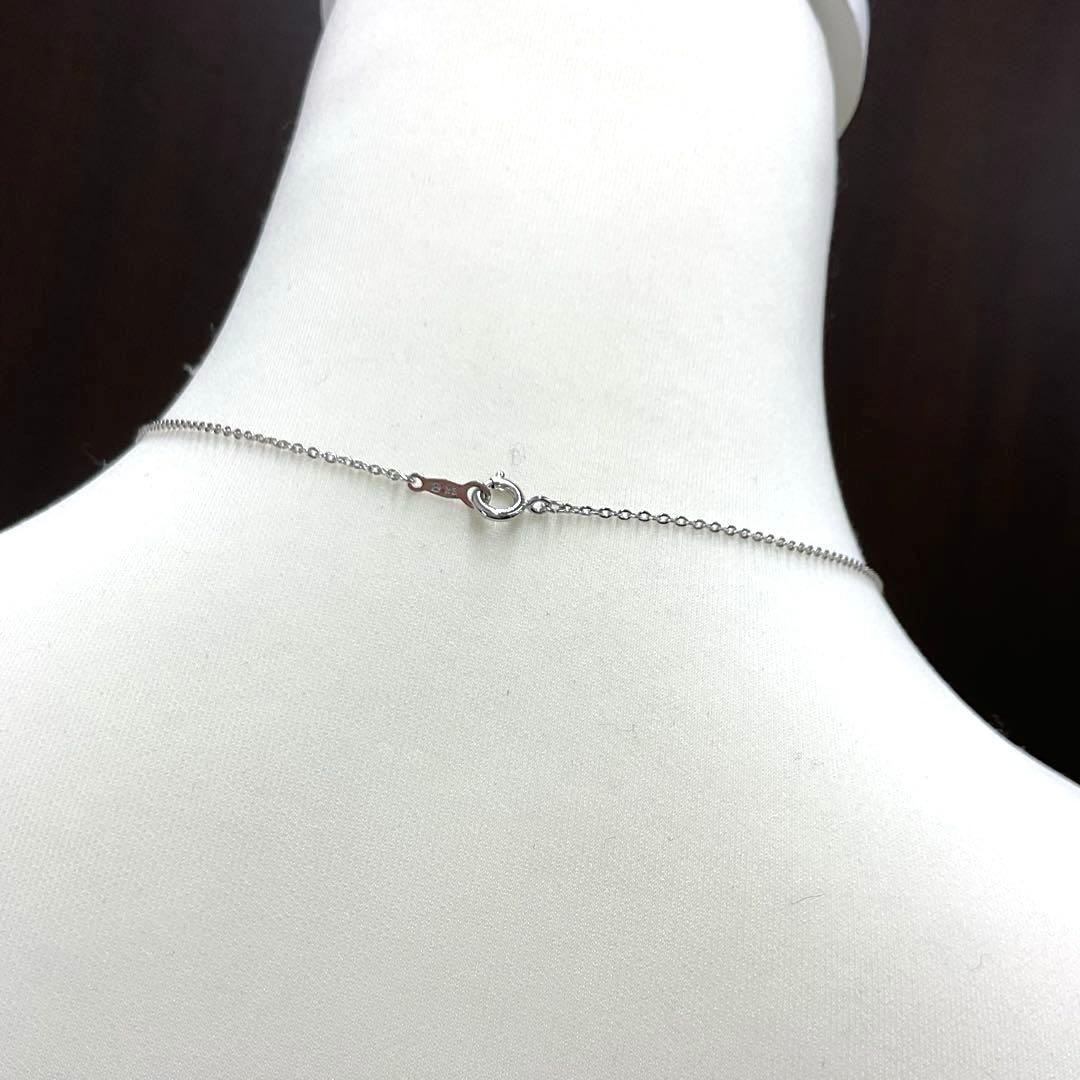 Mikimoto pearl necklace in silver with detailed clasp and round pearls displayed