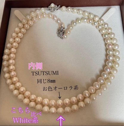 Tsutsumi Aurora Akoya pearl necklace and matching earrings with 8mm round pink-green pearls and silver clasps