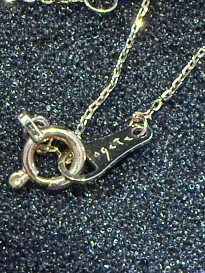 agete K10 gold necklace featuring a glowing opal pendant on a delicate chain