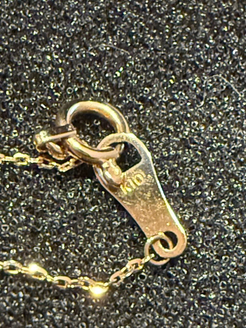 agete K10 gold necklace featuring a glowing opal pendant on a delicate chain