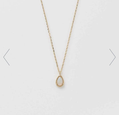 agete K10 gold necklace featuring a glowing opal pendant on a delicate chain