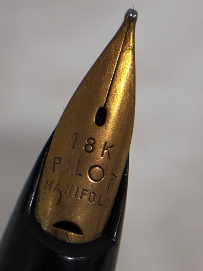 PILOT Fountain Pen 18K with gold nib and sleek black body shown in close-up