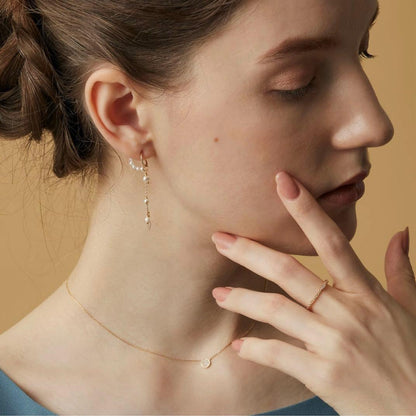 Agaat 18k gold necklace with micro-set diamonds displayed with its box