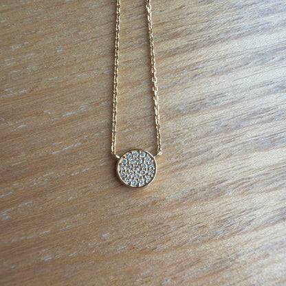 Agaat 18k gold necklace with micro-set diamonds displayed with its box