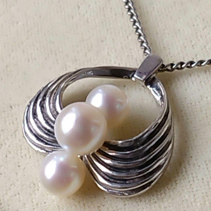 Vintage MIKIMOTO Akoya pearl necklace featuring three 6.5-7.5 mm pearls on a 40 cm silver chain